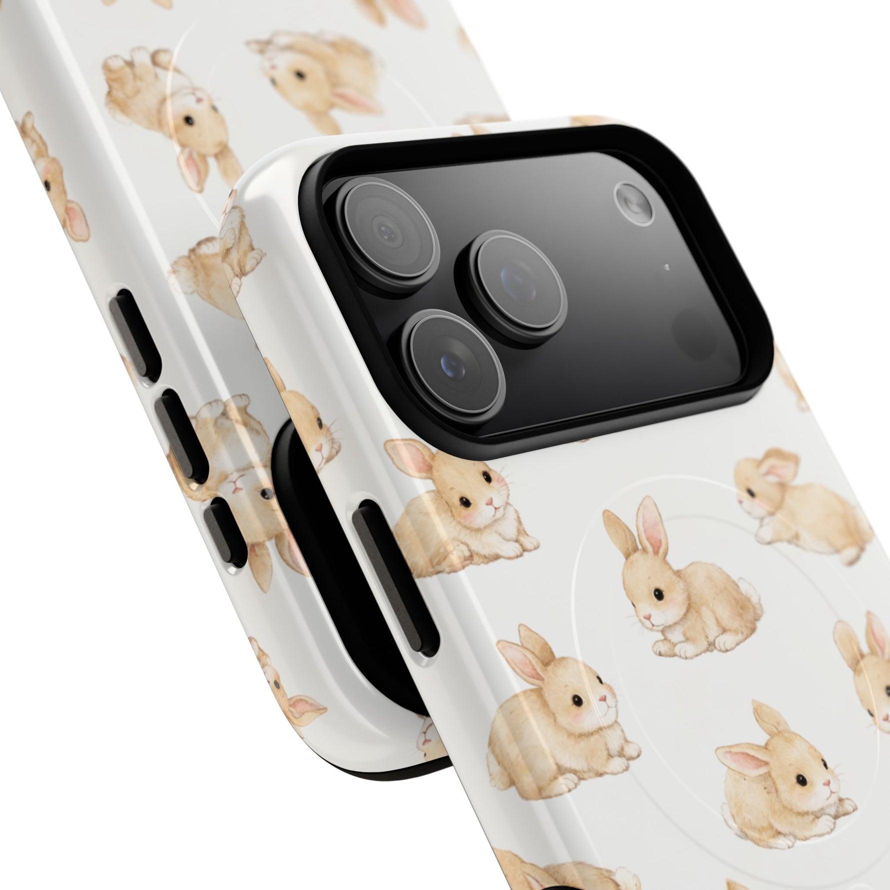 Close-up of two white phone cases with cute beige bunny patterns, showing size variant on smartphone