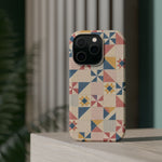 Prairie Quilt – Pastel Patchwork Pattern MagSafe Phone Case, glossy square triple-camera Pro model, rear view on a tabletop