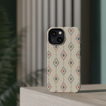 Desert Diamonds – Pastel Geometric Pattern MagSafe Phone Case, glossy diagonal dual-camera model, rear view on a tabletop