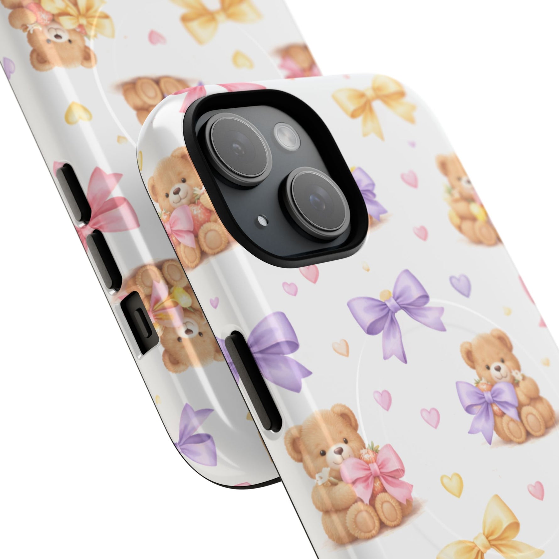 Close-up of phone cases with cute teddy bear and pastel bow pattern, shown in two sizes