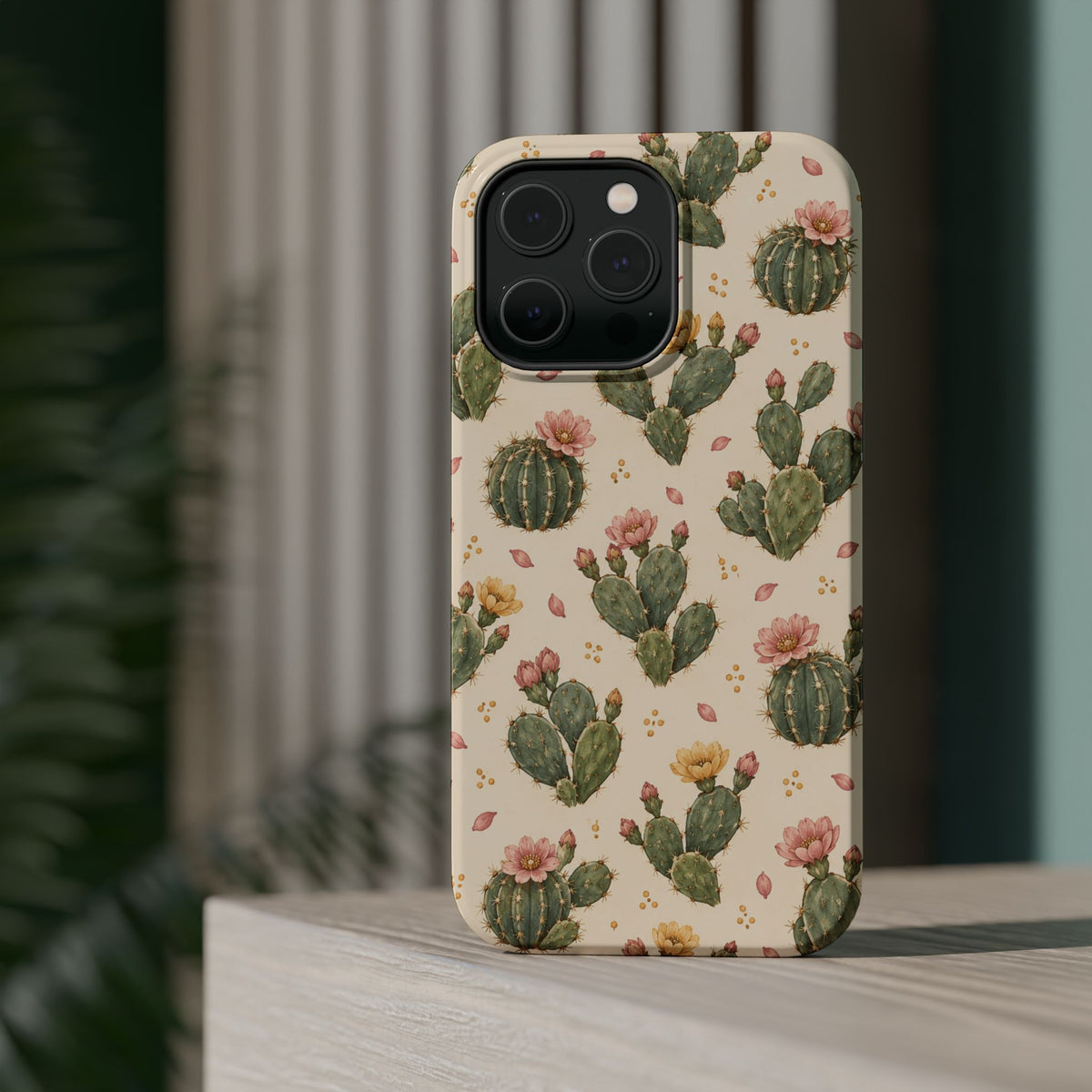 Cactus Bloom – Sage Green Floral Cactus MagSafe Phone Case, glossy square triple-camera Pro model, rear view on a tabletop