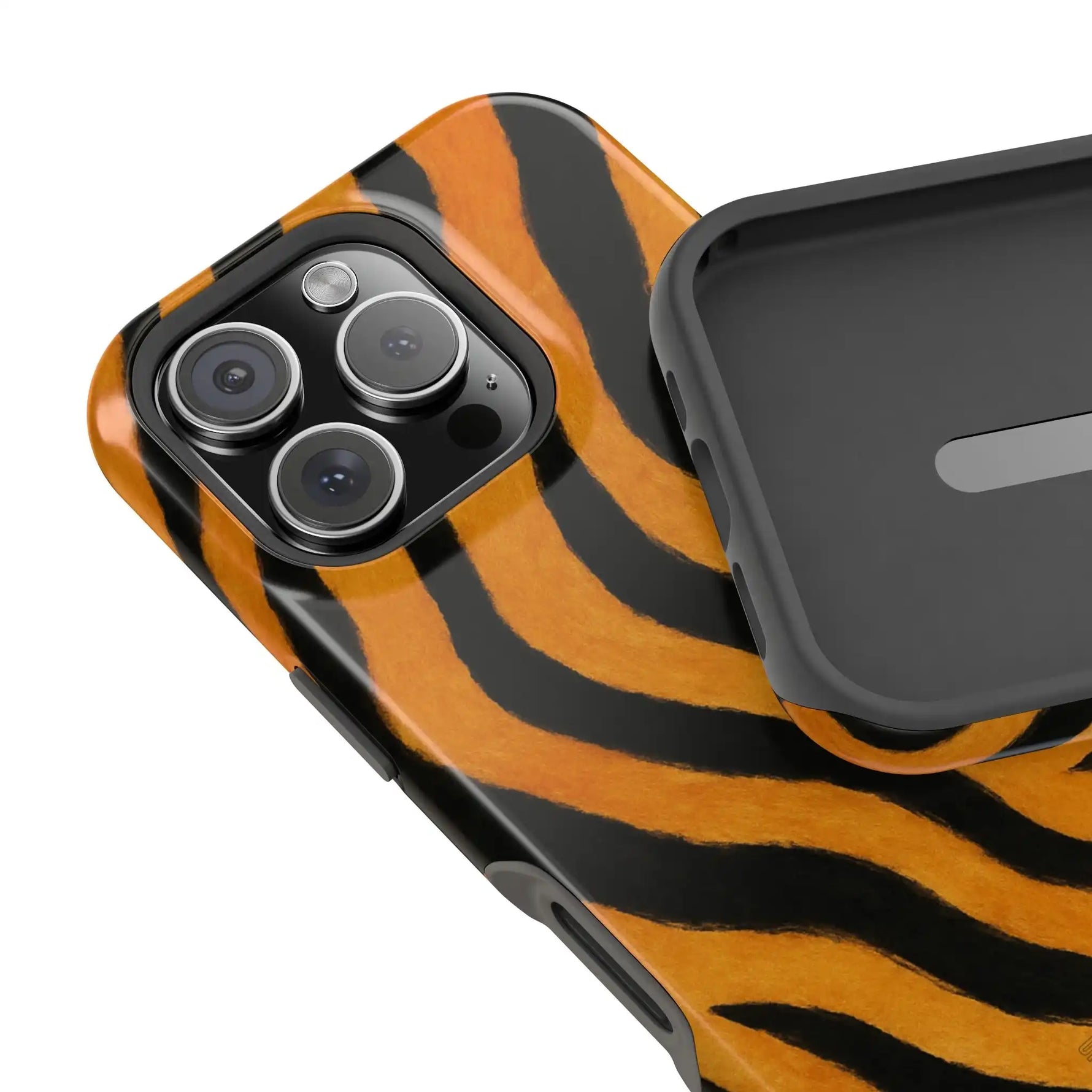 Close-up of iPhone with tiger striped case and separate protective case showing size variant