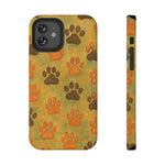 Slim iPhone case with orange and brown paw print pattern on yellow-green background, front and side view