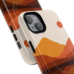Two size variants of iPhone cases with abstract orange and brown mountain design and circular wireless charging marks