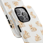 Two iPhone cases with cute beige bunny pattern, showing large and small sizes side by side