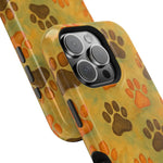 Two variant size phone cases with yellow background and brown orange paw print pattern