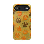 iPhone case with large and small brown and orange paw print pattern on yellow-green background