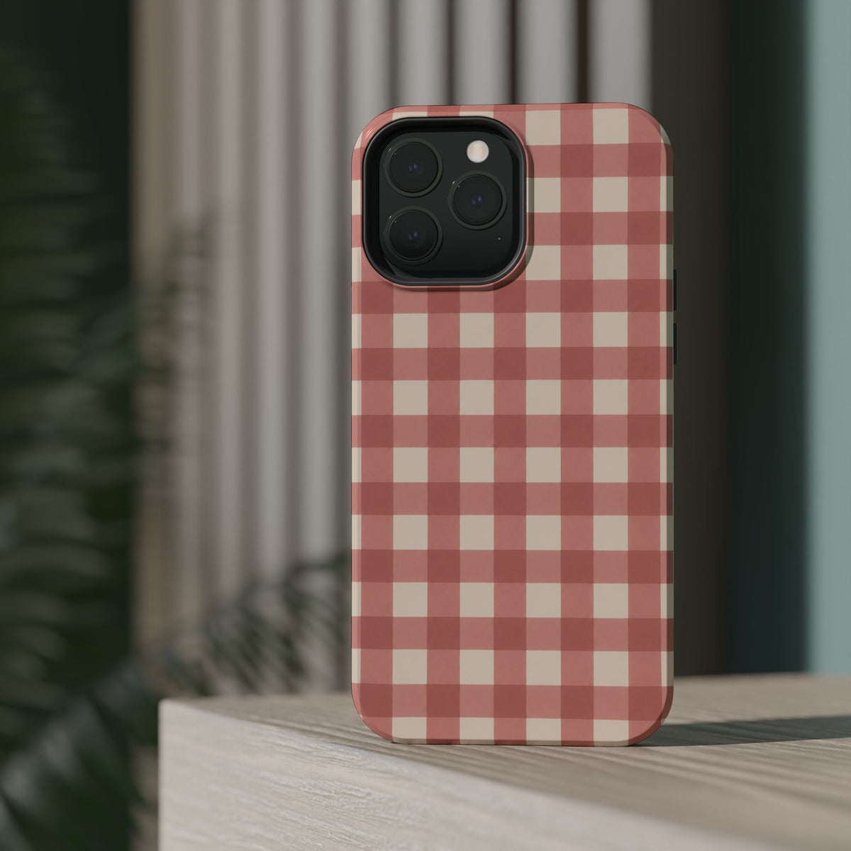 Prairie Gingham MagSafe Phone Case, glossy square triple-camera Pro model, rear view on a tabletop