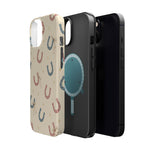 Prairie Horseshoes MagSafe Phone Case, glossy diagonal dual-camera model, exploded shell and liner with magnetic ring