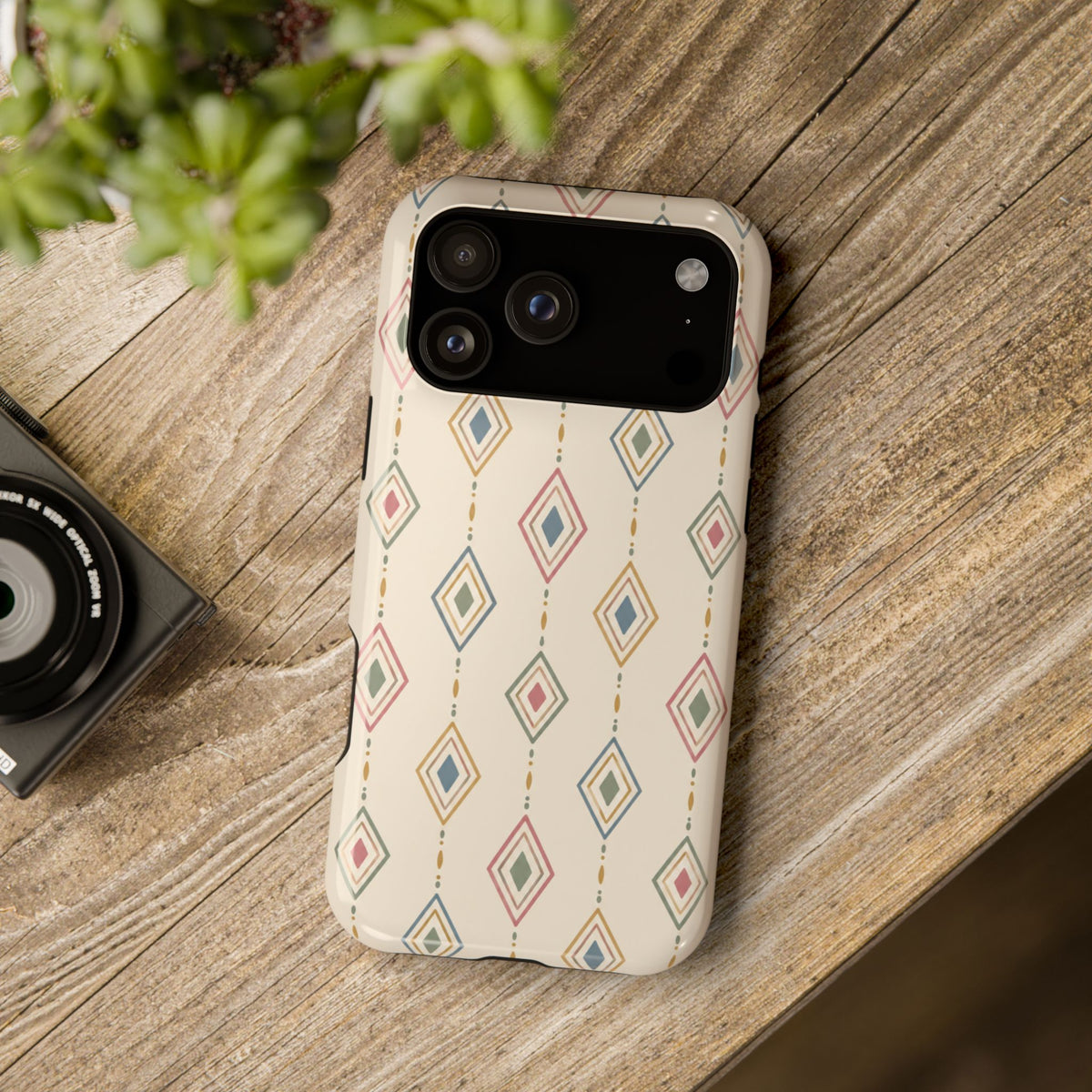 Desert Diamonds – Pastel Geometric Pattern MagSafe Phone Case, glossy wide-camera Pro Max model, rear view on a wooden surface