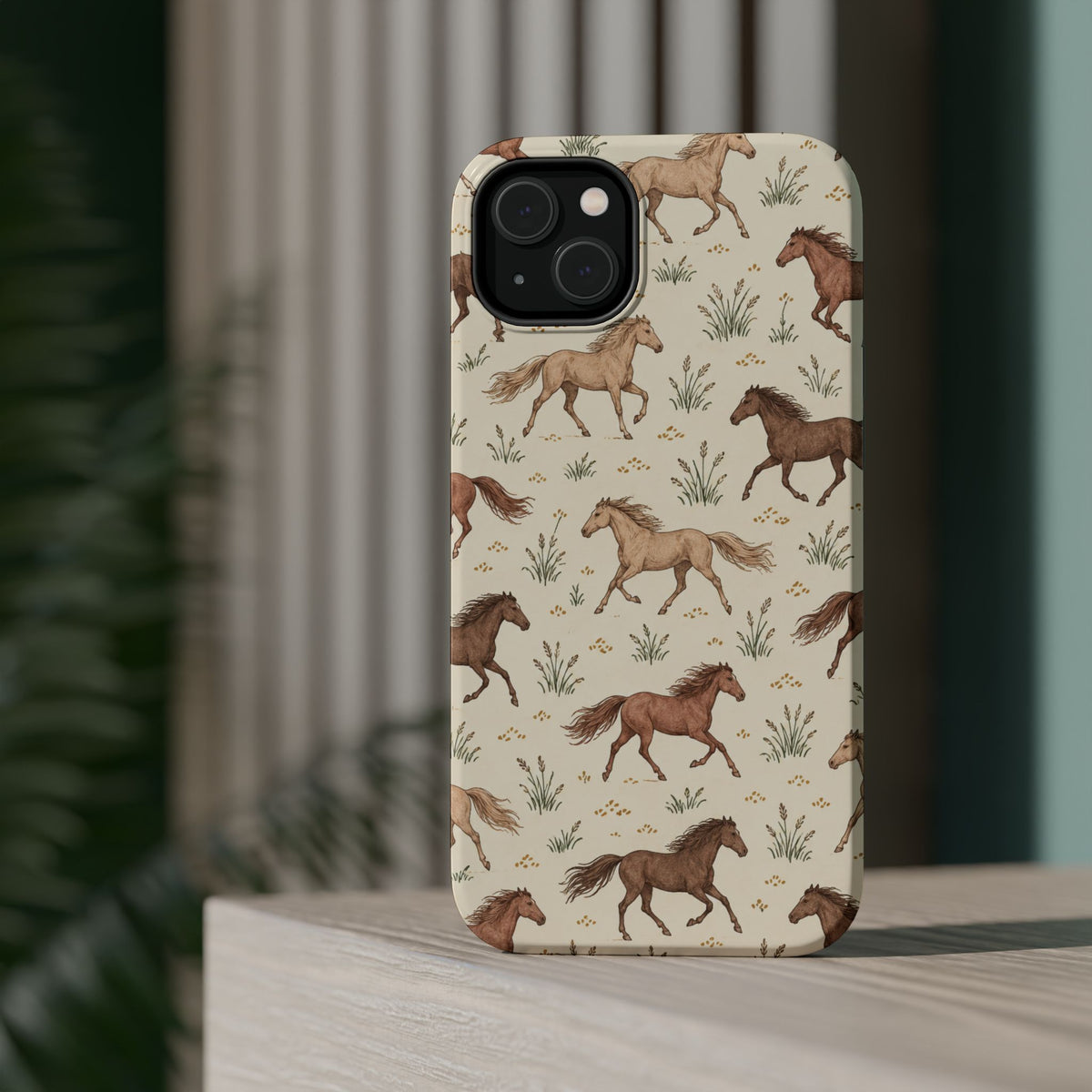Wild Mustangs – Western Horse Pattern MagSafe Phone Case, glossy diagonal dual-camera model, rear view on a tabletop