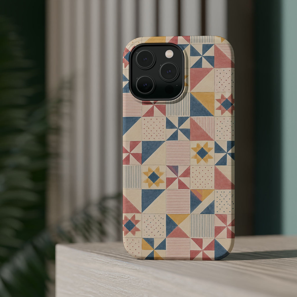 Prairie Quilt – Pastel Patchwork Pattern MagSafe Phone Case, glossy square triple-camera Pro model, rear view on a tabletop