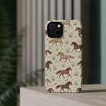 Wild Mustangs – Western Horse Pattern MagSafe Phone Case, glossy diagonal dual-camera model, rear view on a tabletop