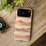 Sunset Trails – Desert Landscape MagSafe Phone Case, glossy wide-camera Pro Max model, rear view on a wooden surface