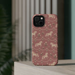 Rose Ponies MagSafe Phone Case, glossy diagonal dual-camera model, rear view on a tabletop