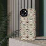 Desert Diamonds – Pastel Geometric Pattern MagSafe Phone Case, glossy diagonal dual-camera model, rear view on a tabletop