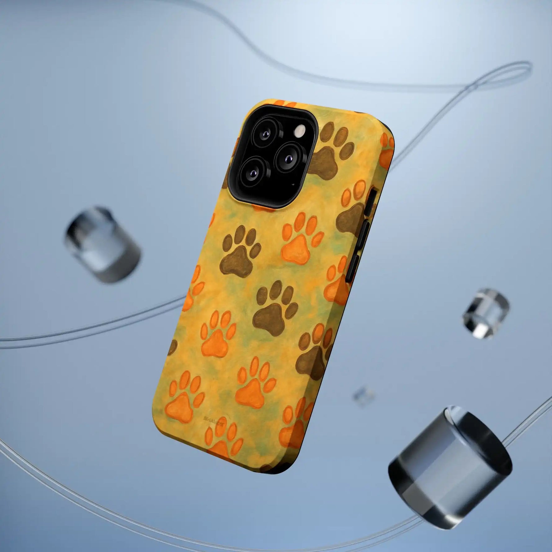Yellow iPhone case with orange and brown paw print pattern showing camera cutout variant size