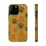 iPhone phone case with yellow background and brown and orange paw print pattern, front and side views