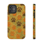 iPhone case with brown and orange dog paw print pattern on a yellow-green background, showing front and side views