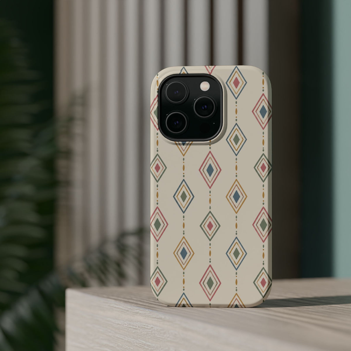 Desert Diamonds – Pastel Geometric Pattern MagSafe Phone Case, glossy square triple-camera Pro model, rear view on a tabletop