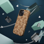 Saddle Scrolls – Tan Western Scrollwork MagSafe Phone Case, glossy diagonal dual-camera model, rear view with magnetic accessories