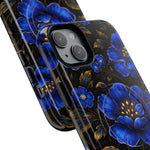 Two sizes of black phone cases with vibrant blue floral patterns and gold leaves, showcasing camera cutouts