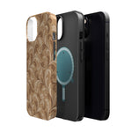 Saddle Scrolls – Tan Western Scrollwork MagSafe Phone Case, glossy diagonal dual-camera model, exploded shell and liner with magnetic ring