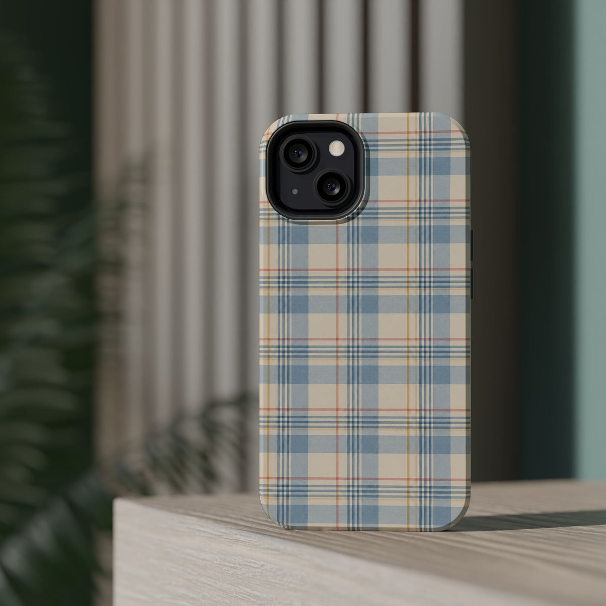 Ranch Check – Blue and Cream Plaid MagSafe Phone Case, glossy diagonal dual-camera model, rear view on a tabletop