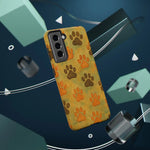 Yellow phone case with orange and brown paw prints design, compatible with Samsung variant size
