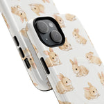 Two smartphone cases in variant sizes with cute beige bunny pattern on white background