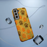Samsung phone case with orange and brown paw prints pattern, showing camera cutout size variant