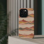 Sunset Trails – Desert Landscape MagSafe Phone Case, glossy square triple-camera Pro model, rear view on a tabletop