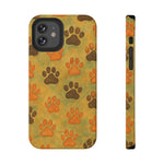 Two views of an iPhone case with orange and brown paw print pattern on a textured beige background, showing front and side size