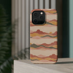 Sunset Trails – Desert Landscape MagSafe Phone Case, glossy square triple-camera Pro model, rear view on a tabletop