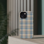 Ranch Check – Blue and Cream Plaid MagSafe Phone Case, glossy diagonal dual-camera model, rear view on a tabletop