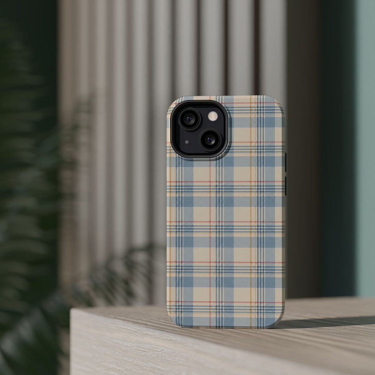 Ranch Check – Blue and Cream Plaid MagSafe Phone Case, glossy diagonal dual-camera model, rear view on a tabletop