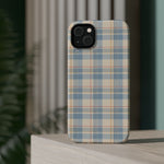 Ranch Check – Blue and Cream Plaid MagSafe Phone Case, glossy diagonal dual-camera model, rear view on a tabletop