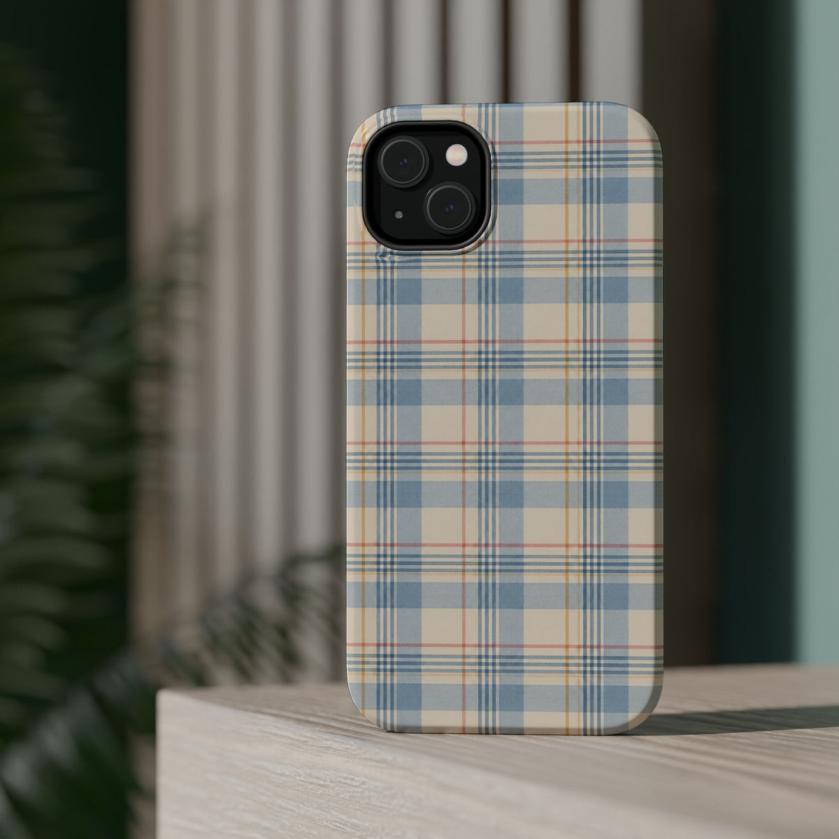 Ranch Check – Blue and Cream Plaid MagSafe Phone Case, glossy diagonal dual-camera model, rear view on a tabletop