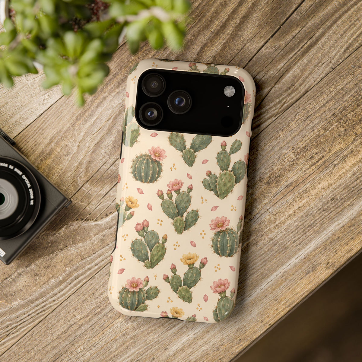 Cactus Bloom – Sage Green Floral Cactus MagSafe Phone Case, glossy wide-camera Pro Max model, rear view on a wooden surface