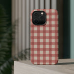 Prairie Gingham MagSafe Phone Case, glossy square triple-camera Pro model, rear view on a tabletop