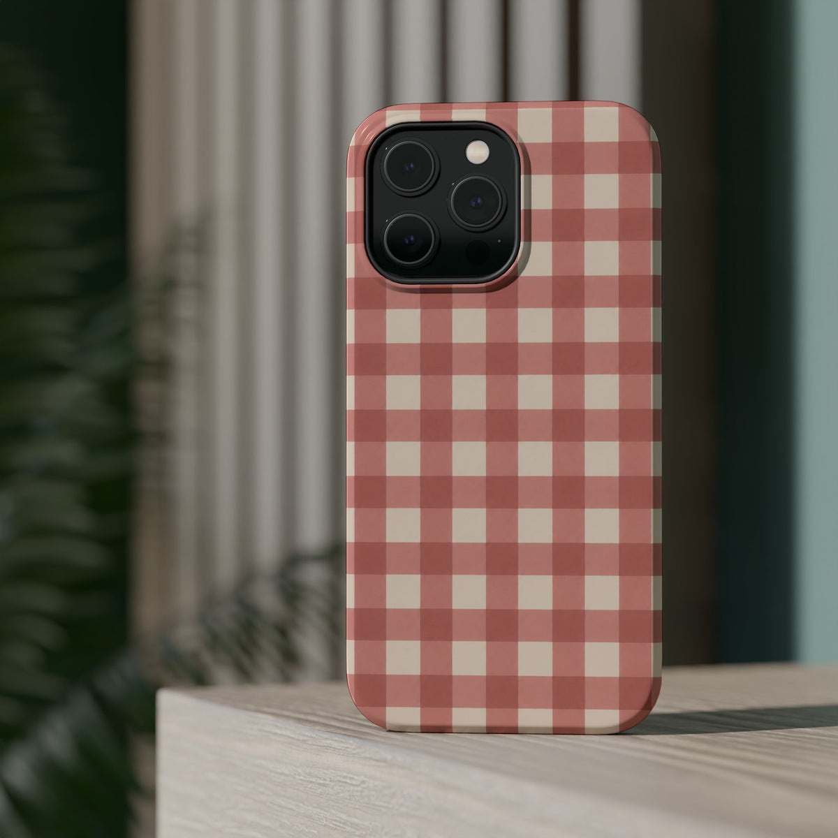 Prairie Gingham MagSafe Phone Case, glossy square triple-camera Pro model, rear view on a tabletop