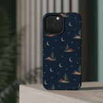 Desert Moon MagSafe Phone Case, glossy square triple-camera Pro model, rear view on a tabletop