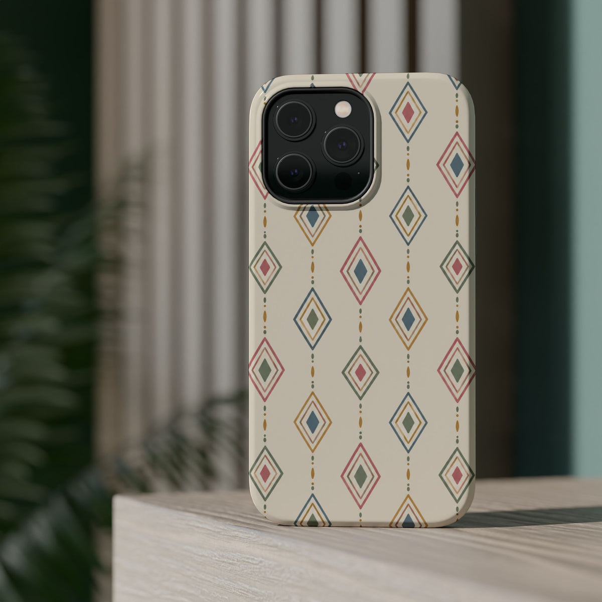Desert Diamonds – Pastel Geometric Pattern MagSafe Phone Case, glossy square triple-camera Pro model, rear view on a tabletop