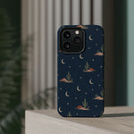 Desert Moon MagSafe Phone Case, glossy square triple-camera Pro model, rear view on a tabletop