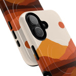Close-up of smartphone with protective case featuring abstract orange and brown mountain design, showing dual camera variant