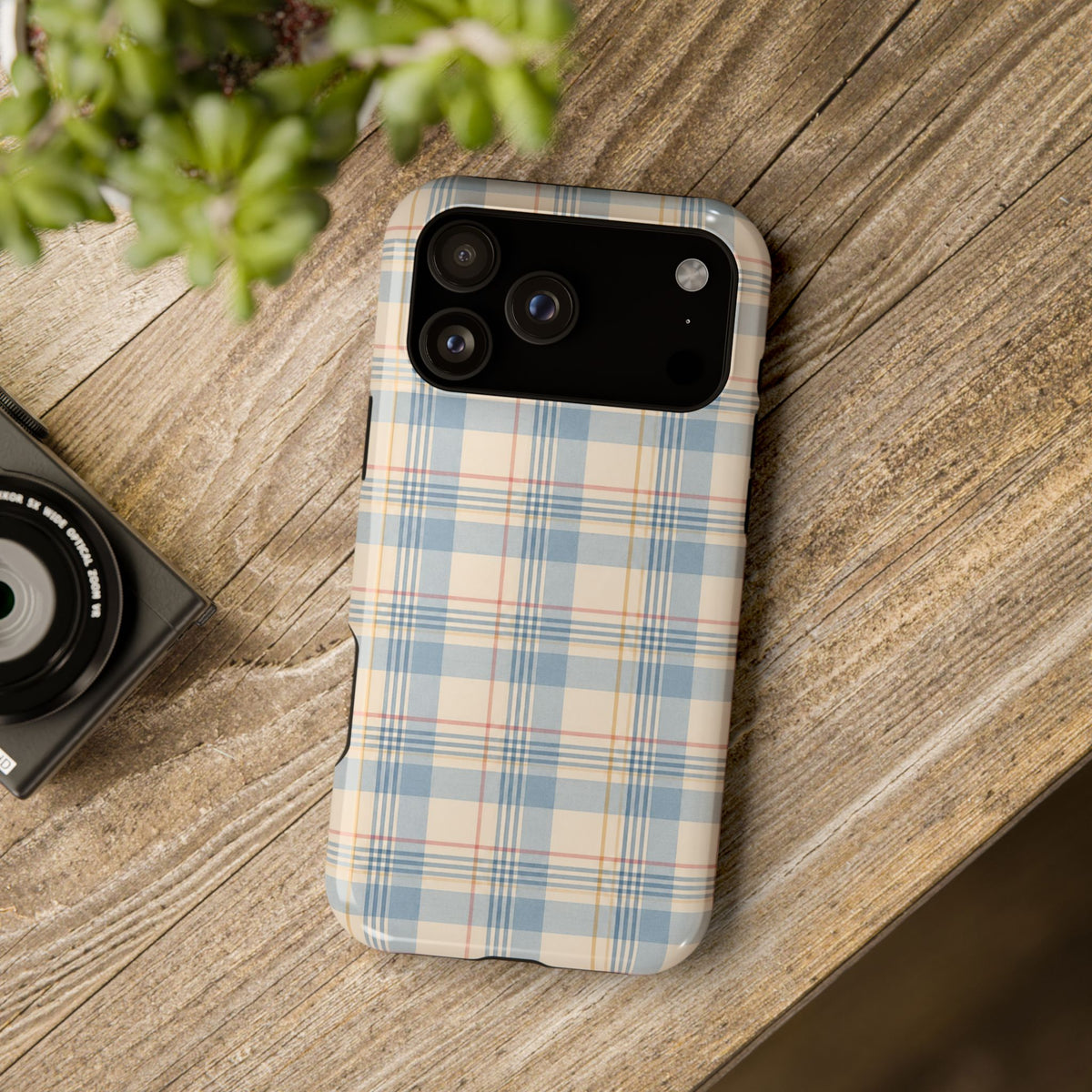 Ranch Check – Blue and Cream Plaid MagSafe Phone Case, glossy wide-camera Pro Max model, rear view on a wooden surface