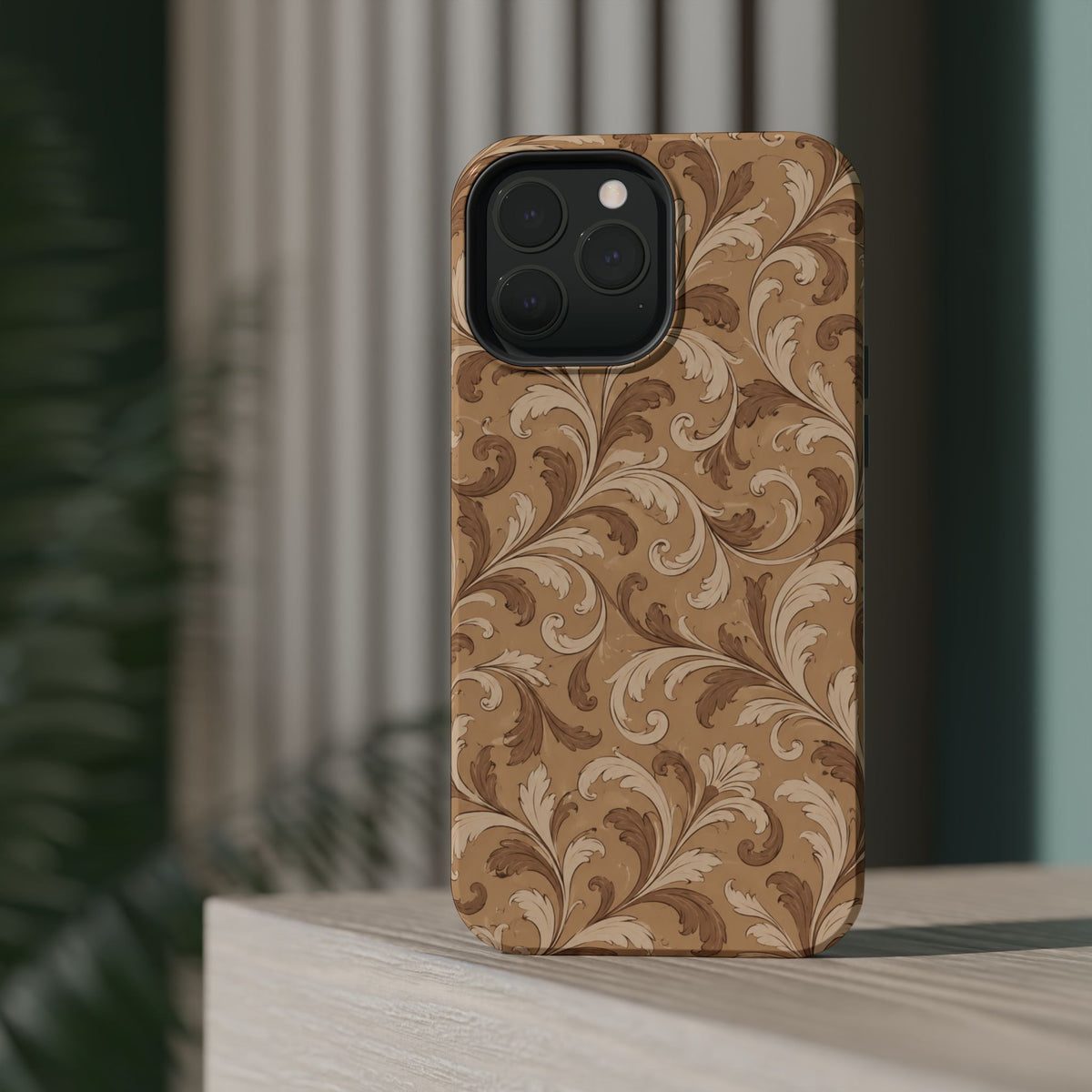 Saddle Scrolls – Tan Western Scrollwork MagSafe Phone Case, glossy square triple-camera Pro model, rear view on a tabletop