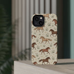 Wild Mustangs – Western Horse Pattern MagSafe Phone Case, glossy diagonal dual-camera model, rear view on a tabletop