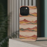 Sunset Trails – Desert Landscape MagSafe Phone Case, glossy square triple-camera Pro model, rear view on a tabletop