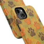 Close-up of two phone cases with multicolor yellow, green, orange, and brown paw print design showing size variant